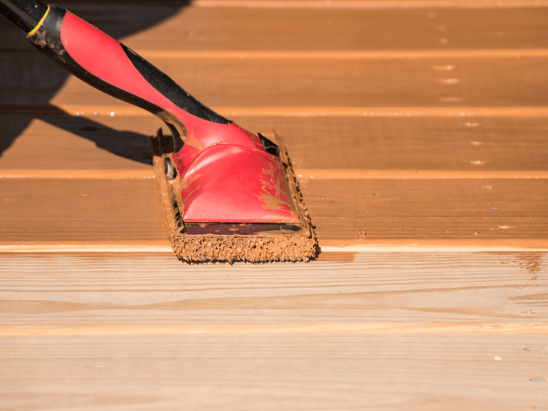 Applying Deck Stain With A Rolling Pad